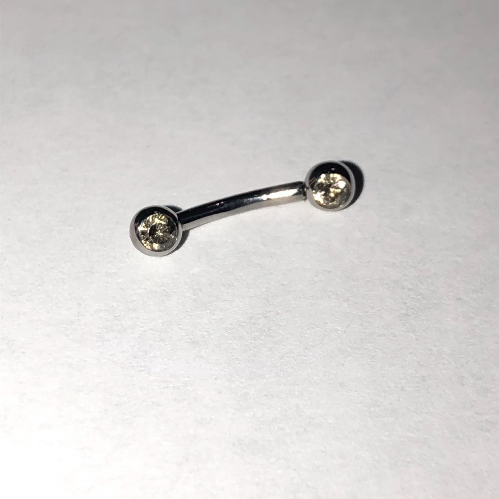 16 gauge titanium curved barbell with champagne cz